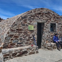 Short rest on the 3205 meters high mountain hut Refugio-Vivac de la Carihuela before we climbed up Pico del Veleta
